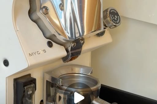 Close up of a portafilter and grinder with an educational graphic about grind size and extraction from Boiler's Summer Coffee School series