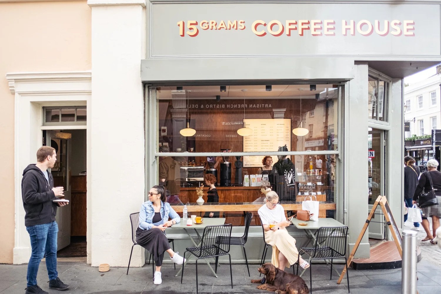 The 15 Grams Coffee House storefront at the entrance to Greenwich Market, with outdoor seating on the pavement