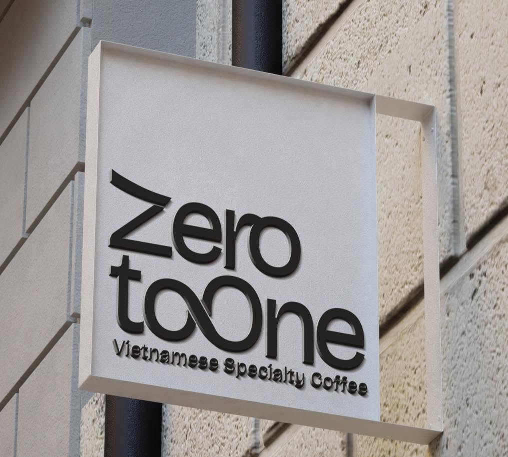 The ZeroToOne storefront sign, reading Zero to One, Vietnamese Specialty Coffee, mounted on a stone wall