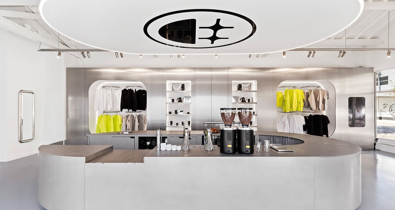 The curved stainless steel counter and retail apparel display at BIGFACE
