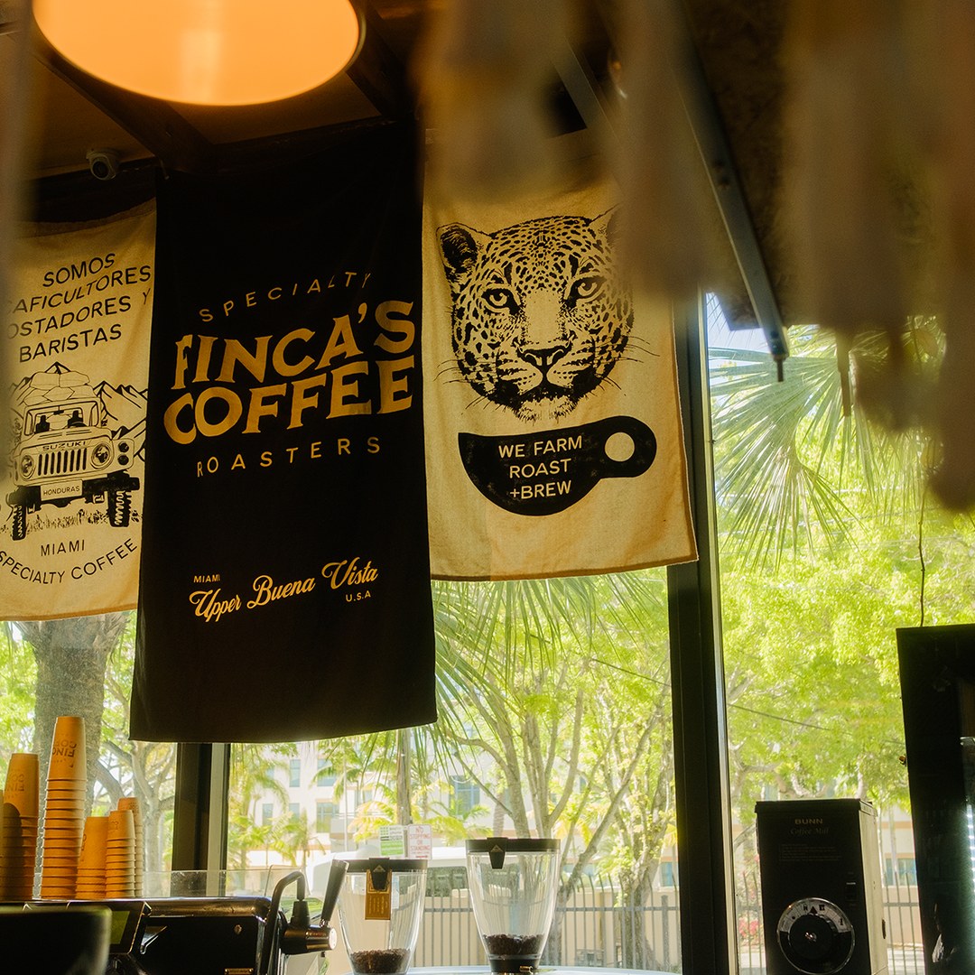 Finca's Coffee Roasters banners hanging above the batch brew station