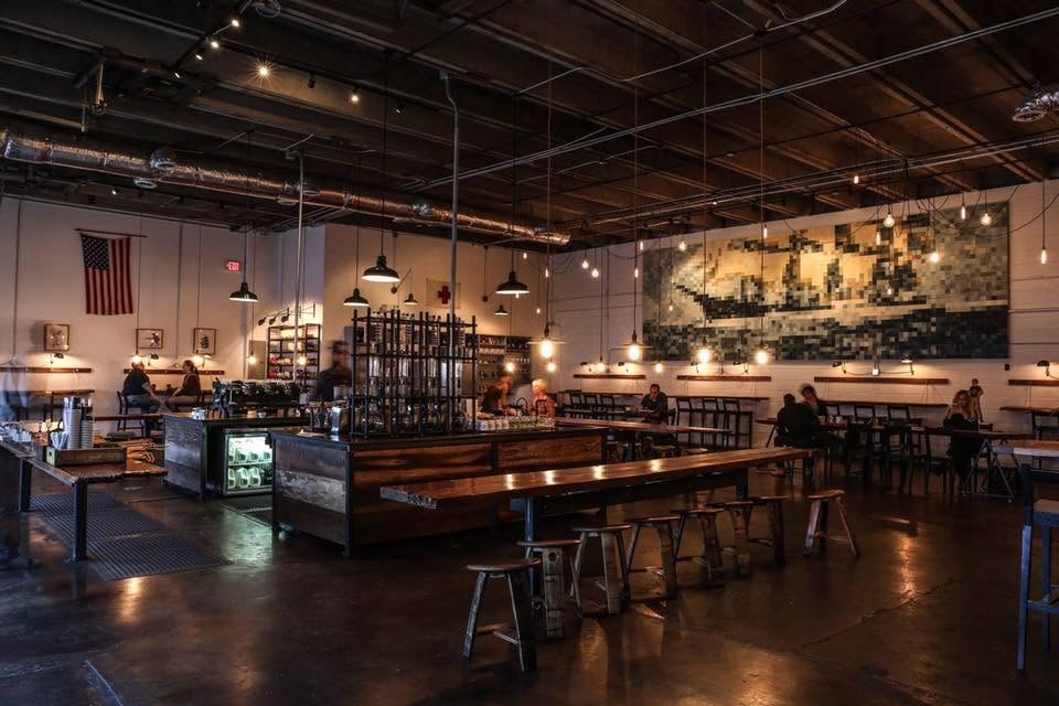 The industrial room and mosaic mural wall at Barista Parlor East Nashville