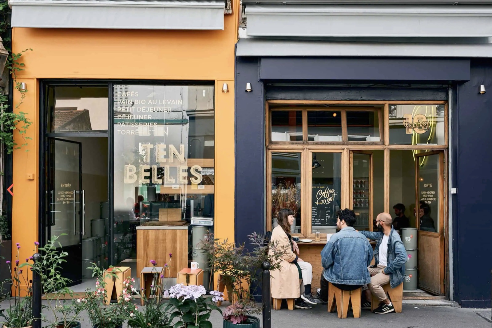 The orange-fronted Ten Belles storefront with gold lettering in the window, customers seated at the outdoor counter next door