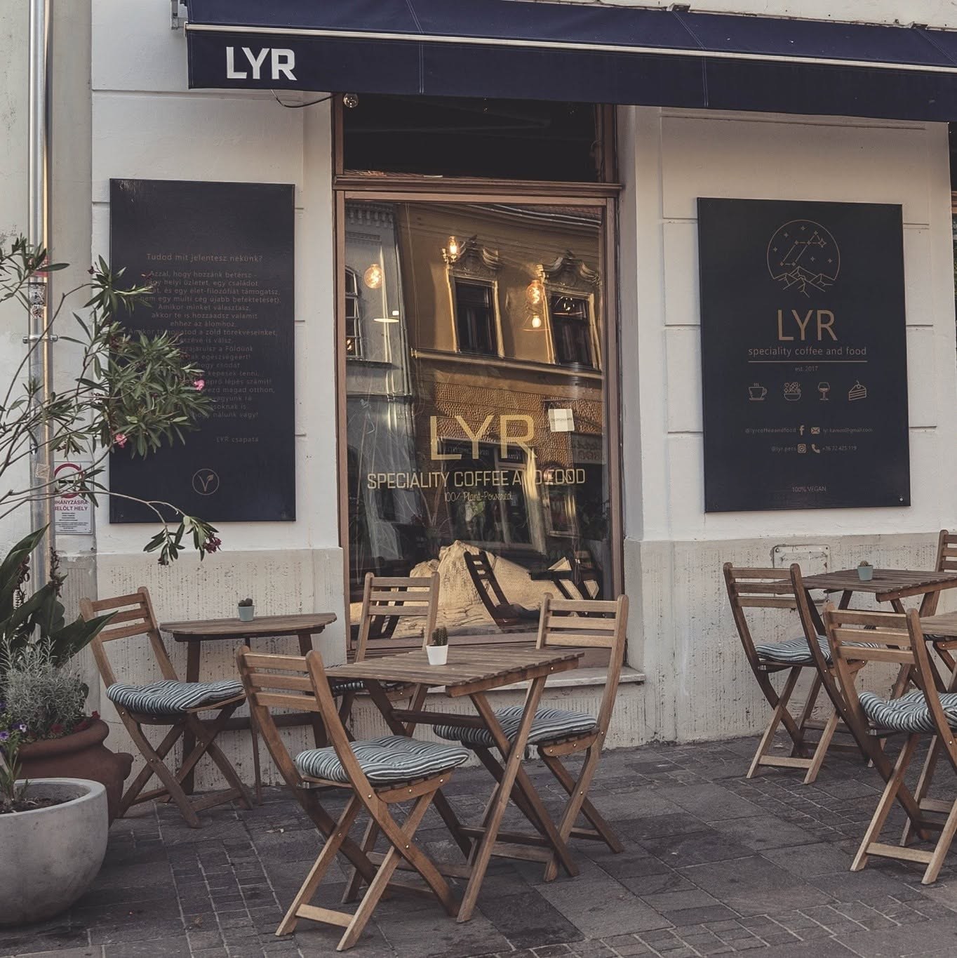 The LYR storefront with its speciality coffee and food signage and outdoor tables