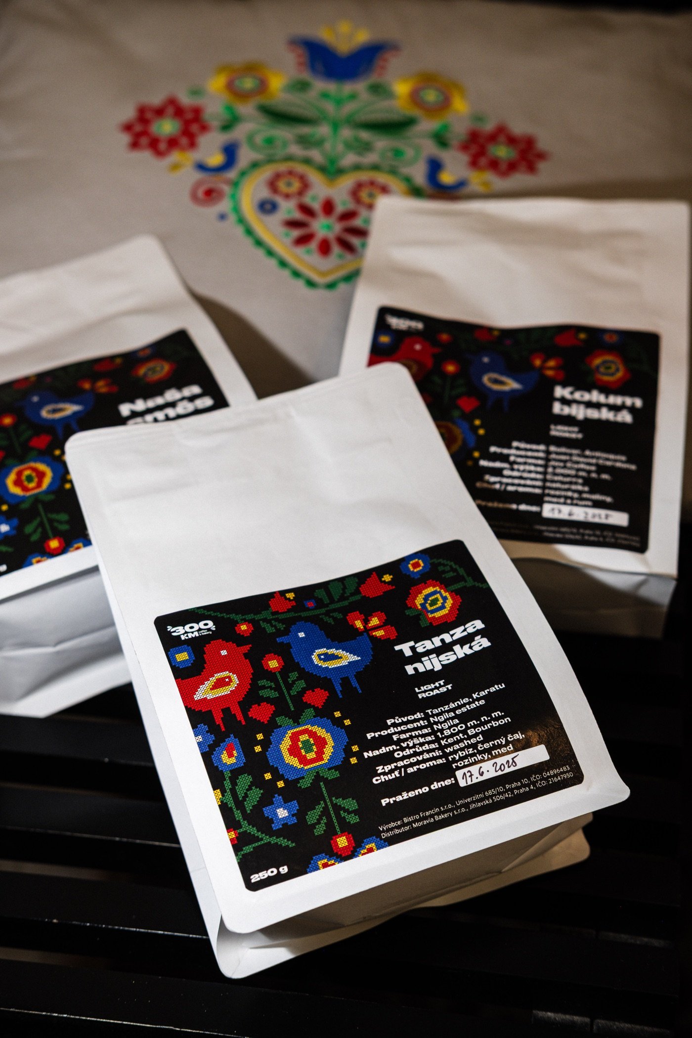 Retail coffee bags with Moravian folk art labels from 300km coffee and bakery
