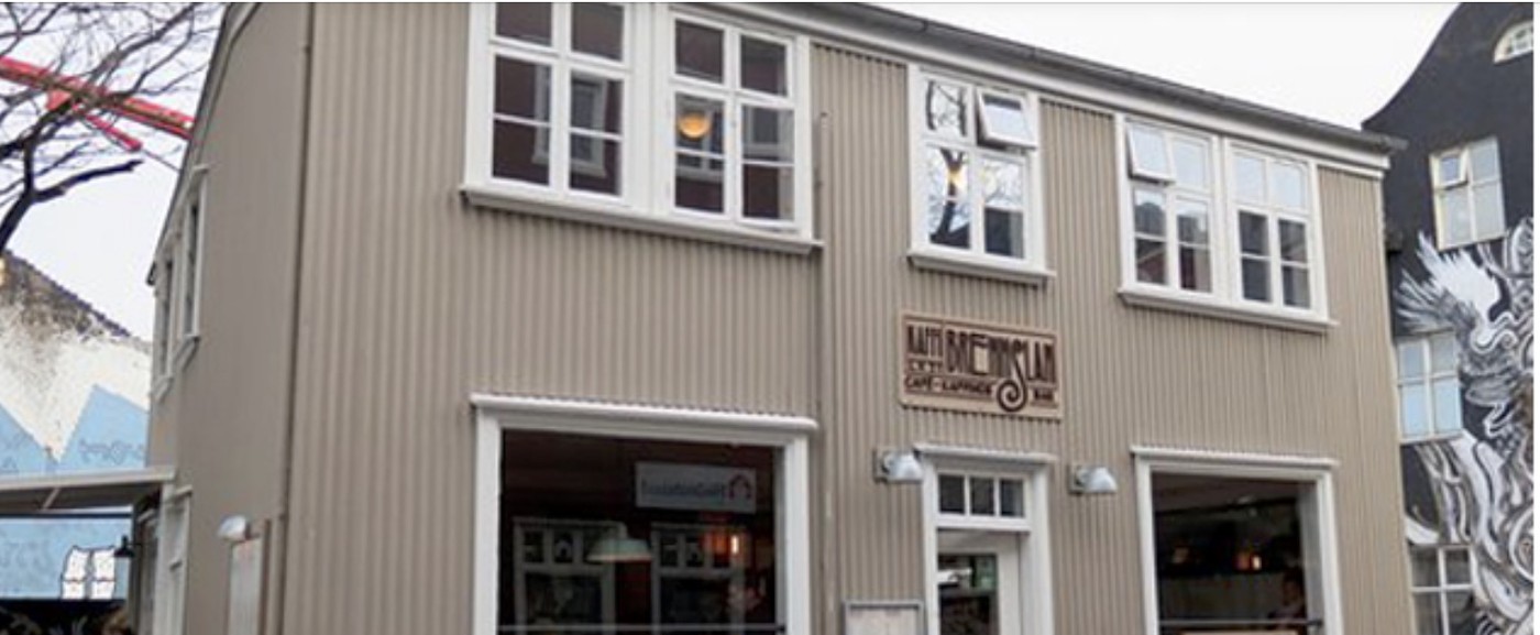 The corrugated metal facade of Kaffibrennslan on Laugavegur with its wooden Kaffi Brennslan sign