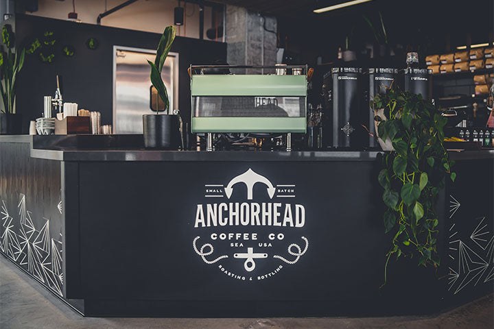 The espresso bar and branded counter at Anchorhead Coffee