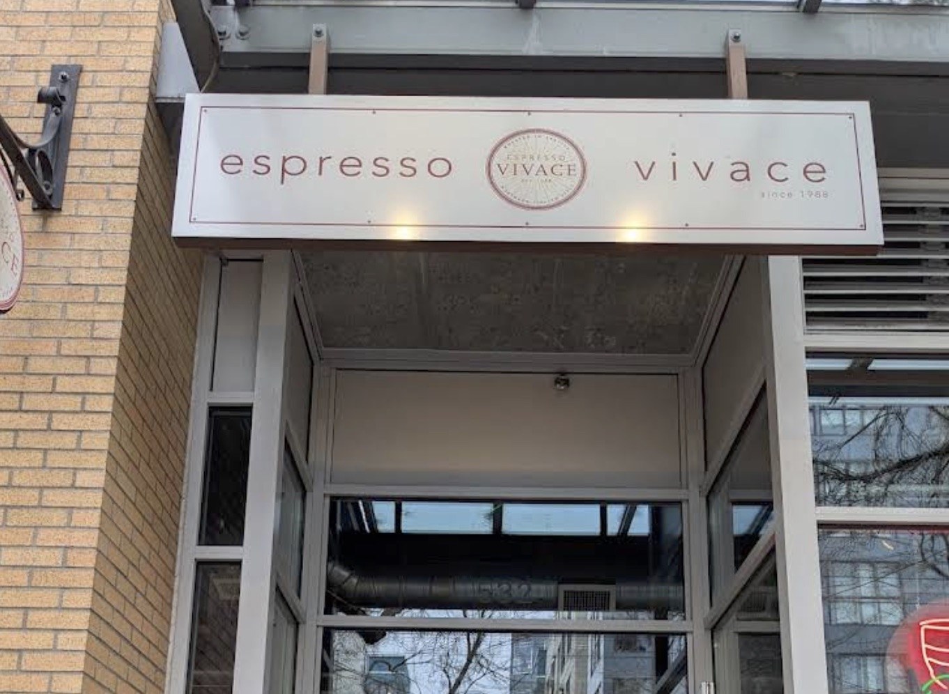 The espresso vivace sign mounted above the Broadway entrance