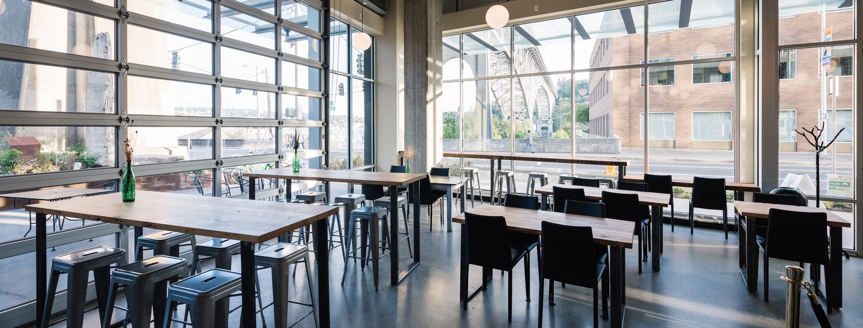The window seating room at Milstead & Co. with a canal bridge view outside