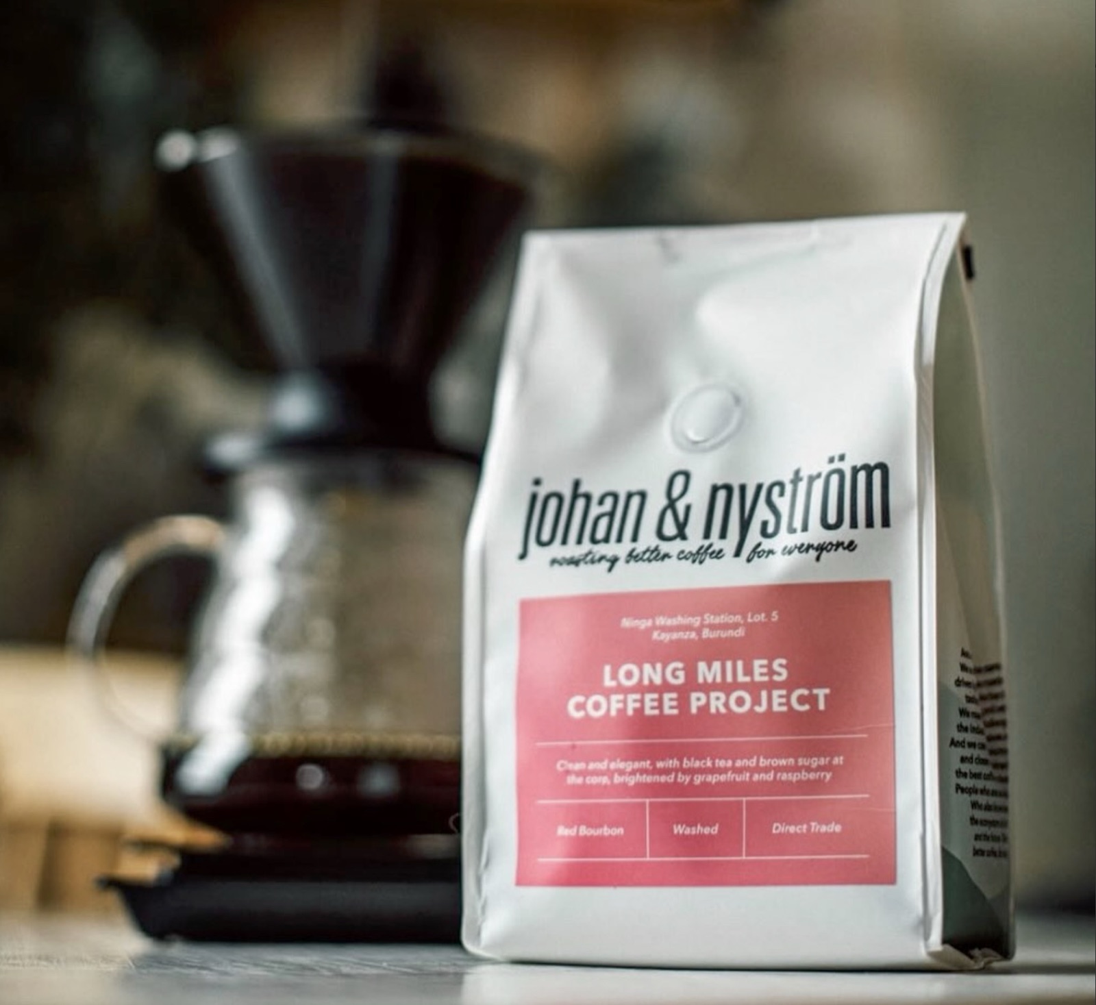 A bagged Johan & Nyström single-origin coffee, Long Miles Coffee Project from Burundi, beside a pour-over brewer