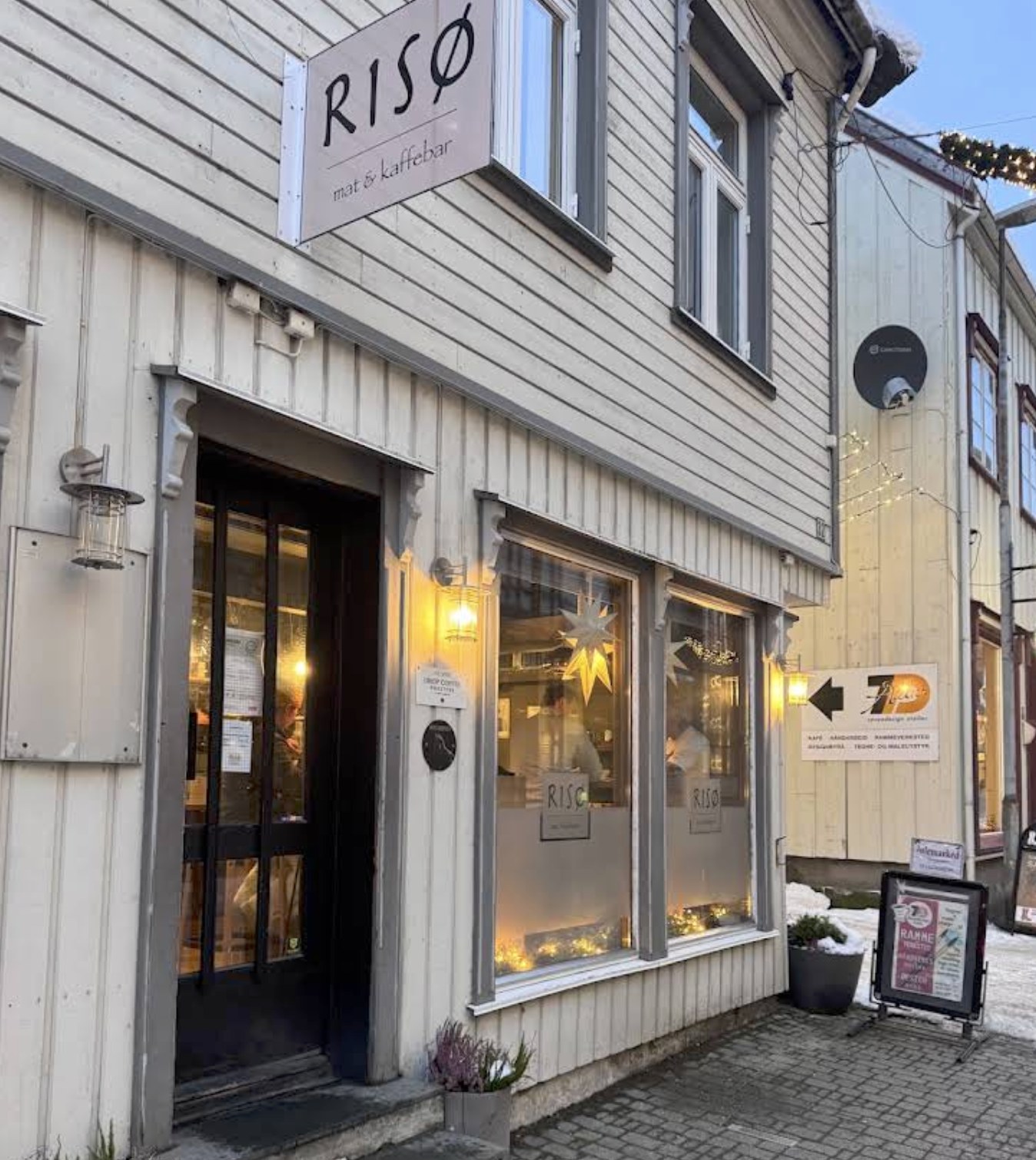 The timber storefront with the branded Riso sign at Riso Mat og Kaffebar