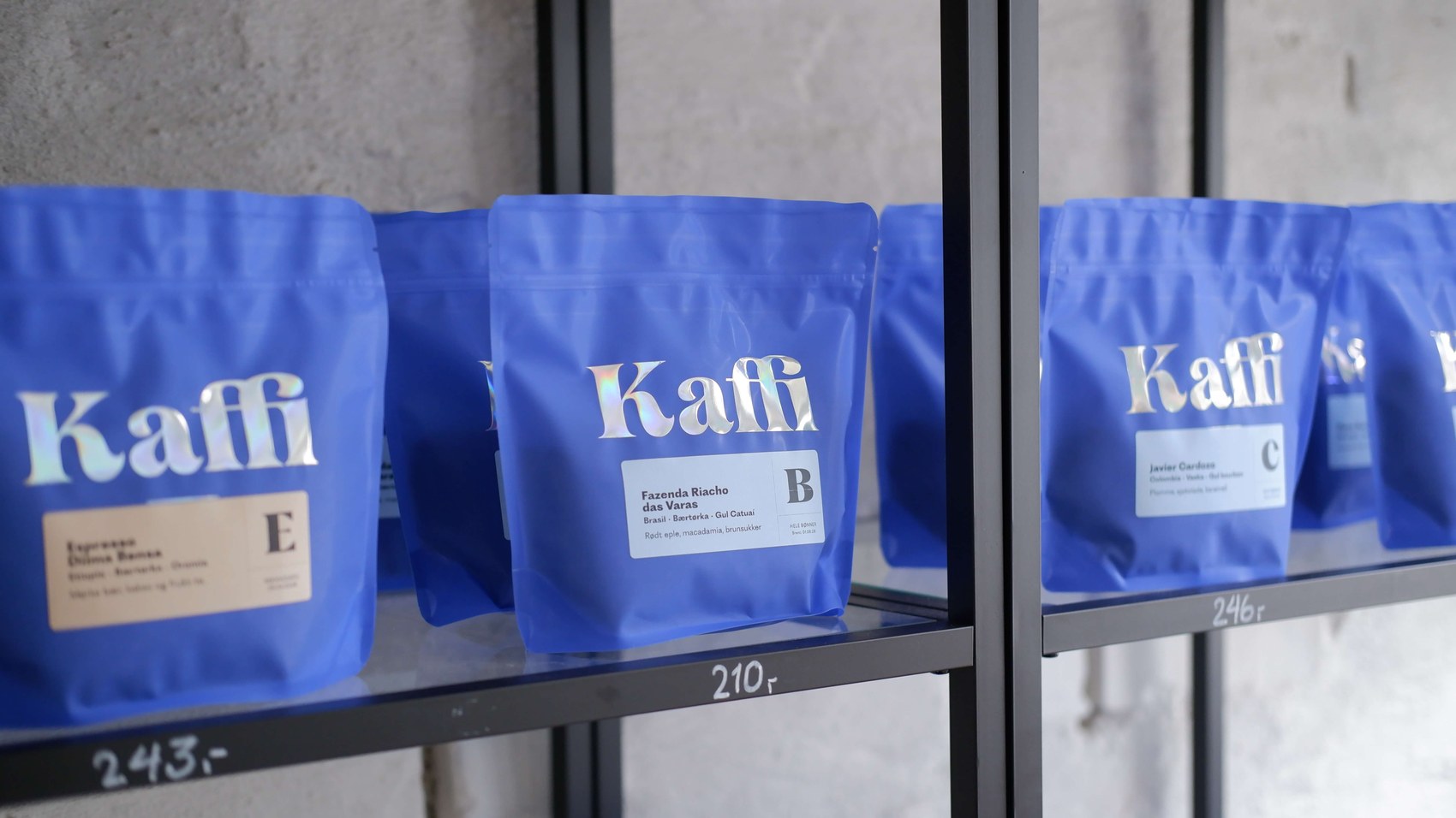 Branded Kaffi retail bags lined up on a shelf